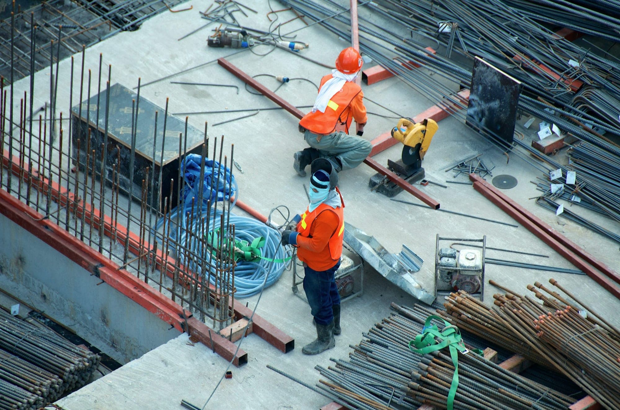 Site engineers coordinating on a reinforced concrete deck